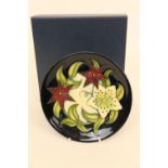 Moorcroft small floral midnight ground dish, circa 2017, designed by Nicola Slaney, 15.5cm diameter,