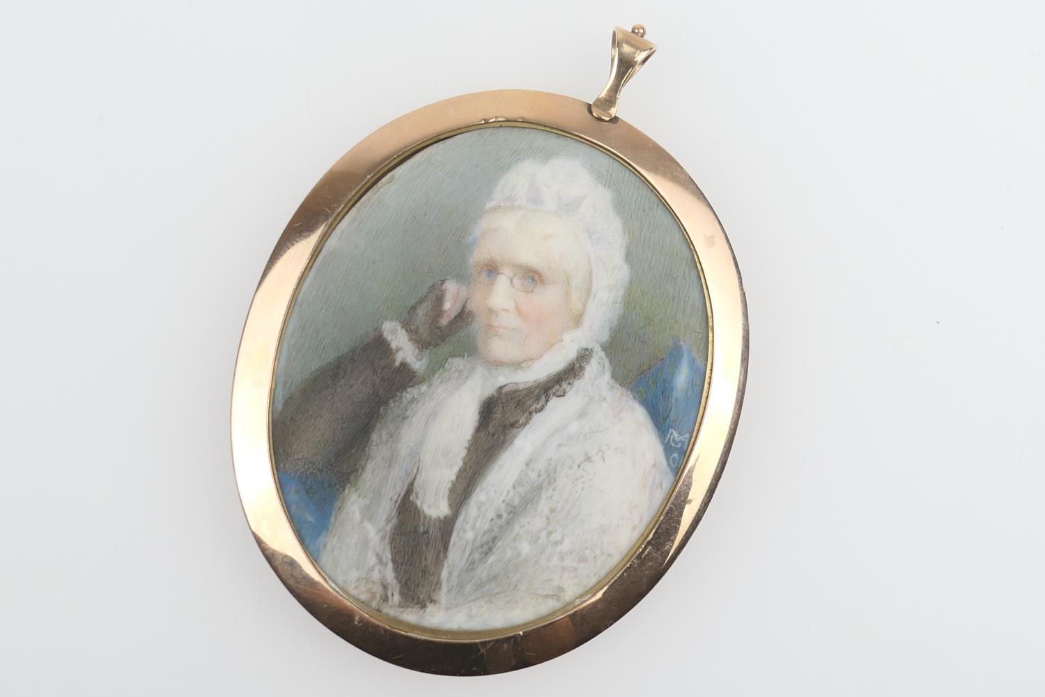 Early 19th Century portrait miniature of an elderly lady in a white lace bonnet, indistinctly signed