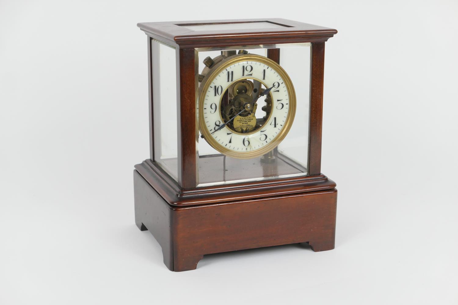 Eureka Clock Company, London, electric mantel timepiece, mahogany four glass case, cream coloured