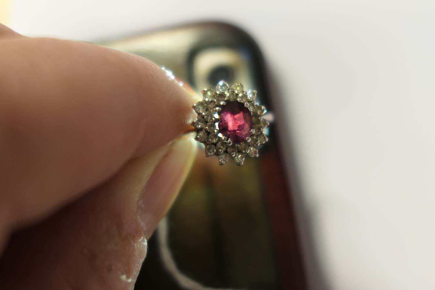 Ruby and diamond cluster ring, the oval cut ruby of approx. 1ct, bordered with small round cut - Image 2 of 9