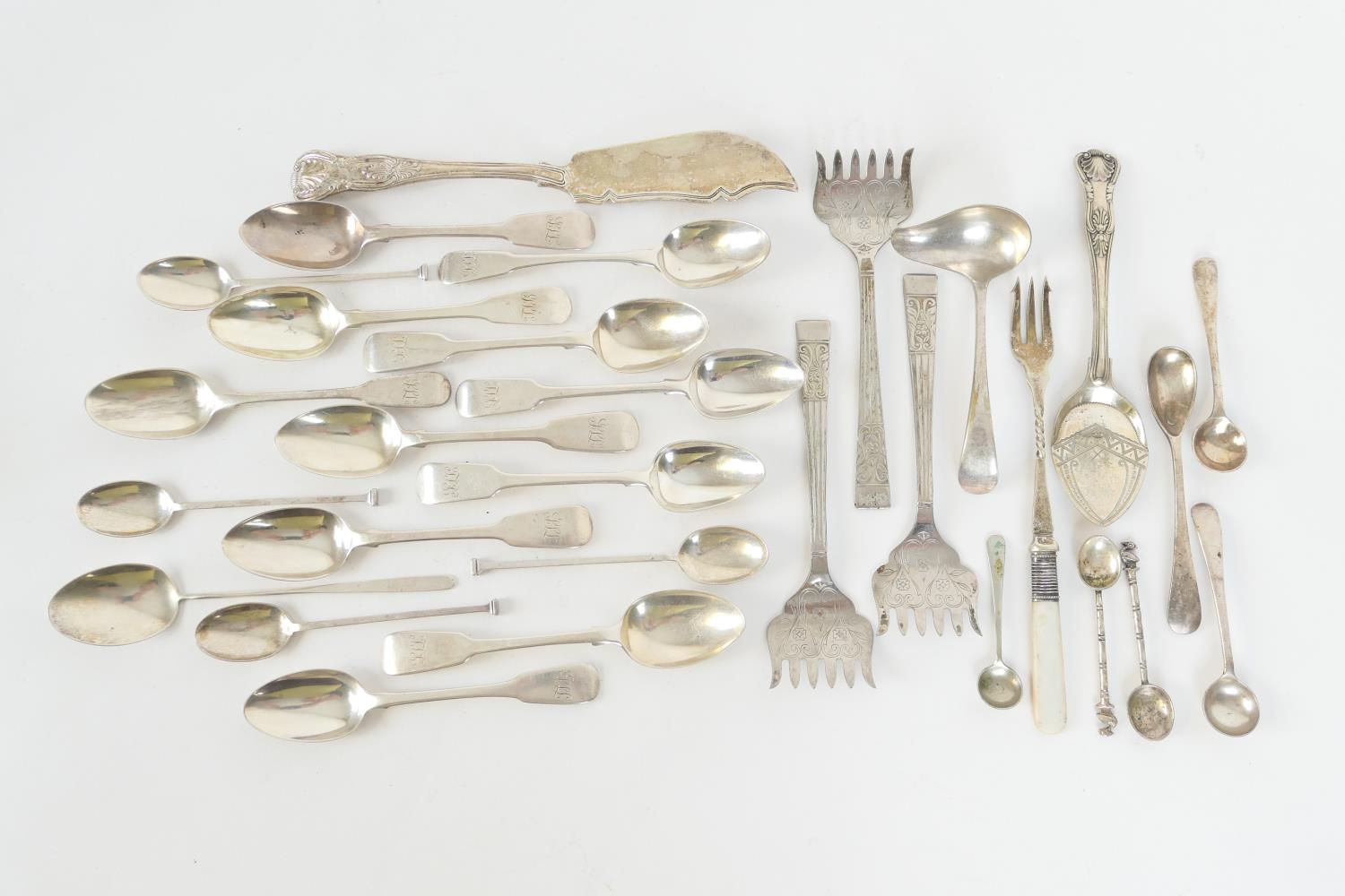 Assortment of Georgian and later silver flatware including Victorian silver Queens pattern butter