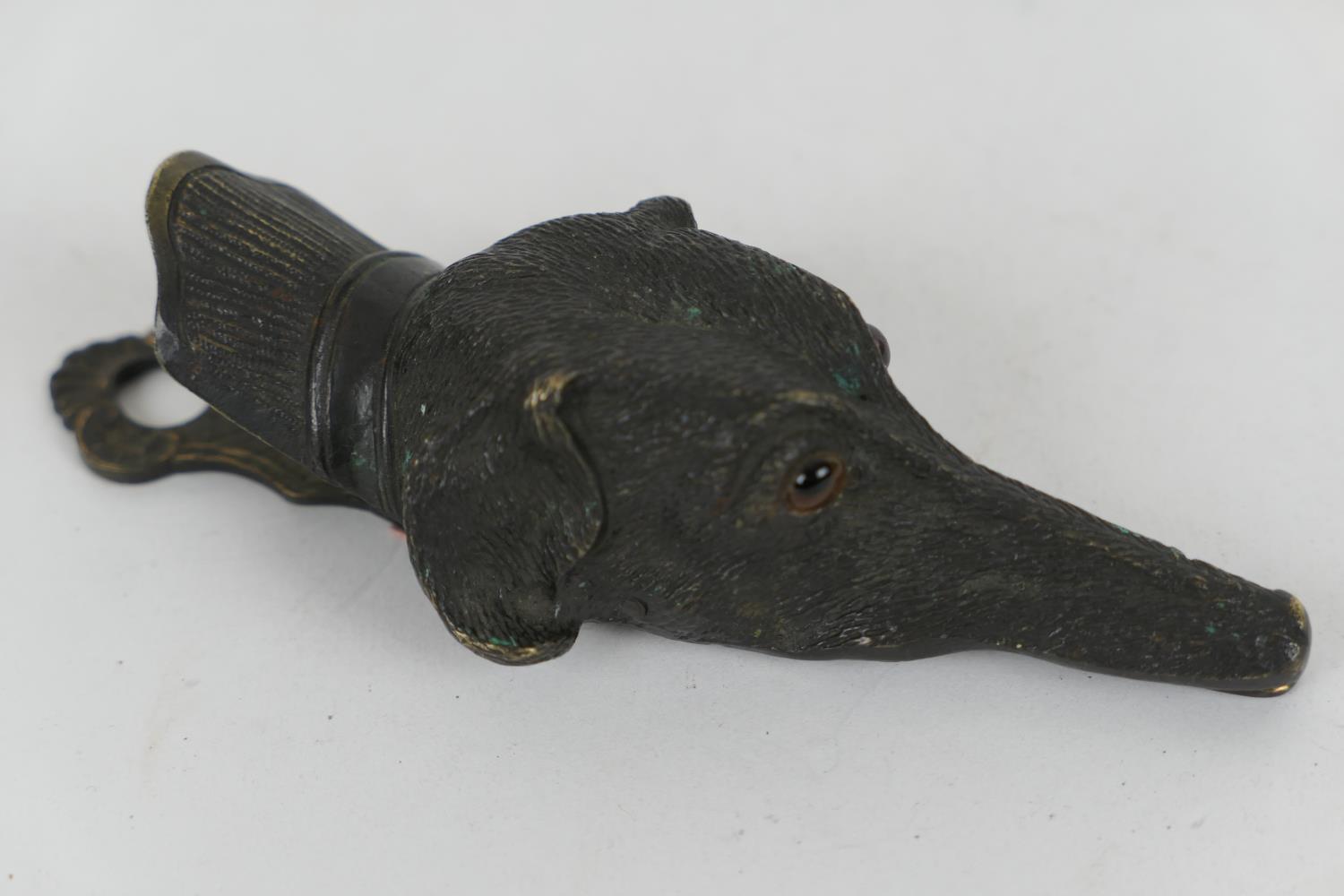 Victorian bronze paper clip, formed as the head of a lurcher, with original glass eyes, 14.5cm