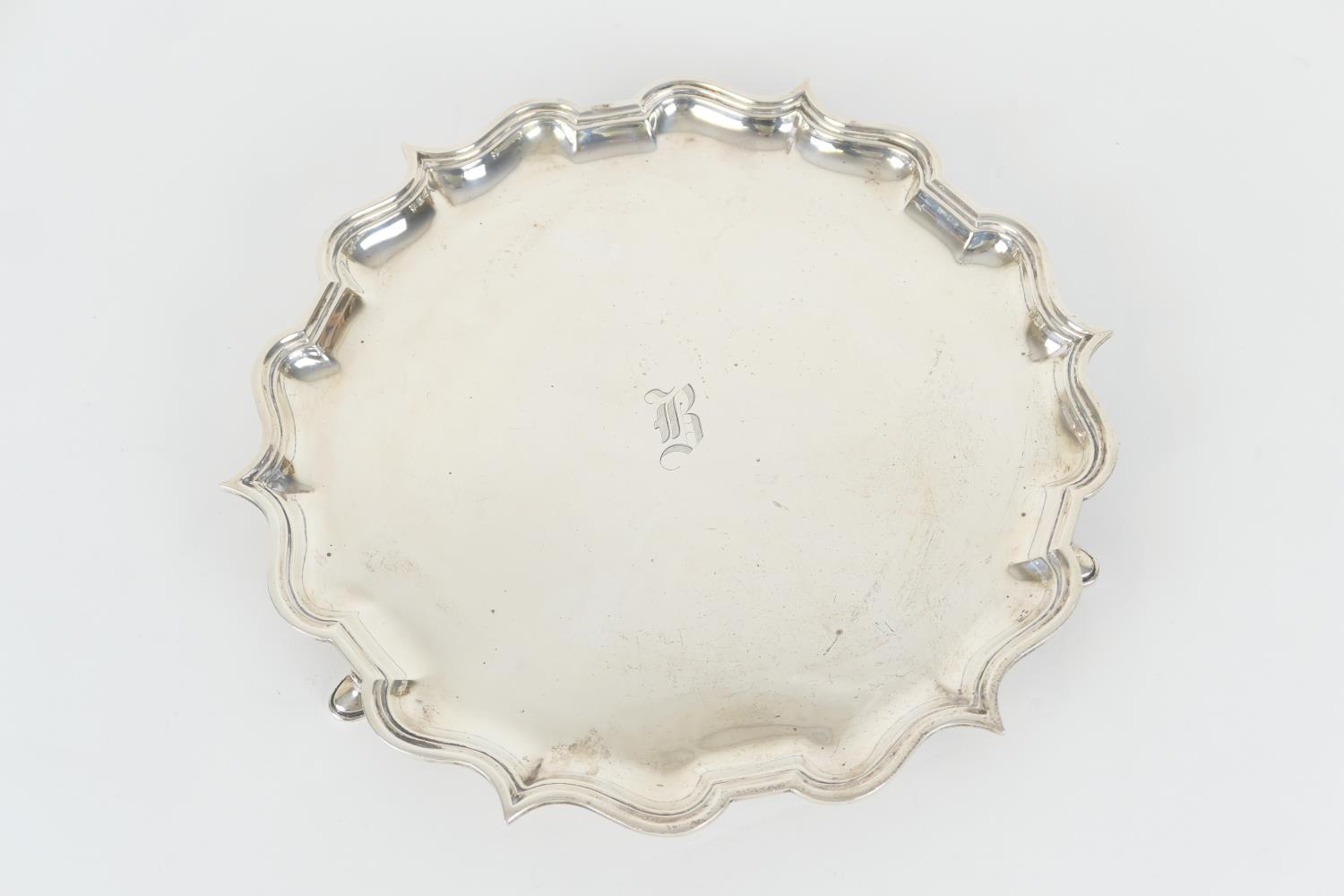 George V silver salver, by Elkington & Co., Birmingham 1934, shaped circular form with a raised