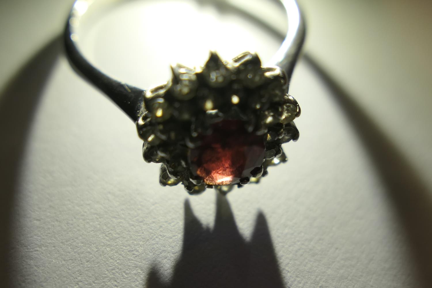 Ruby and diamond cluster ring, the oval cut ruby of approx. 1ct, bordered with small round cut - Image 5 of 9