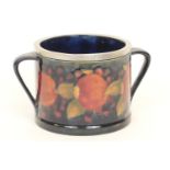 Moorcroft 'Pomegranate' biscuit barrel base, pre-war, with hammered pewter mount, twin handles to
