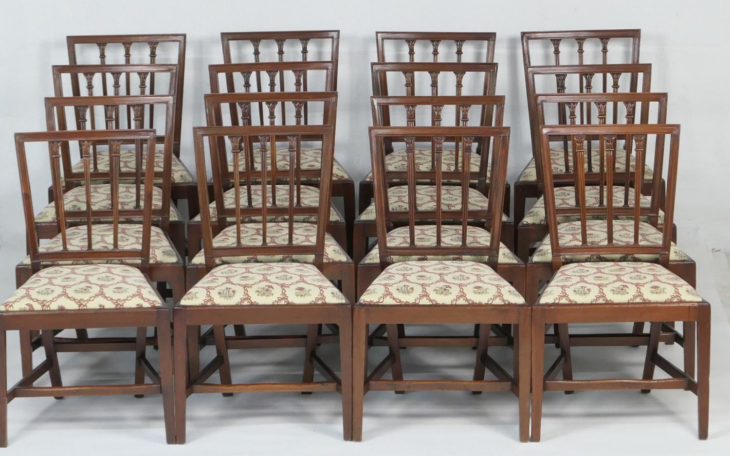 Set of sixteen mahogany stick back dining chairs, early 19th Century, having three reeded stick