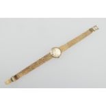 Garrard 9ct gold lady's bracelet wristwatch, circa 1977, silvered 14mm dial with baton numerals,