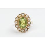 Peridot and pearl cluster ring, in 9ct gold, the oval cut peridot 8mm x 6mm, on a 9ct gold split