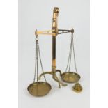 Set of Victorian brass beam scales, complete with pans and nest of weights, height 69cm (NB: