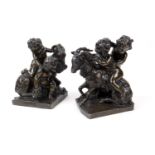 Pair of French bronze Bacchanalian figure groups, each cast as the infant Bacchus and a cherub