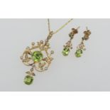 Edwardian peridot and seed pearl openwork pendant brooch, set in 15ct gold, 50mm drop, width 20mm,