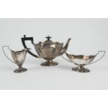 George V silver three piece tea service, Birmingham 1926, comprising teapot of footed and fluted