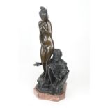 Emile Fuchs (1866-1929), The Arab and odalisque, patinated bronze, raised on a red marble plinth,