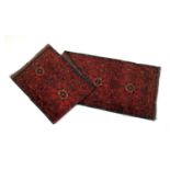 Hamadan red ground runner, centred with star shaped medallions in brown, terracotta and blue, the