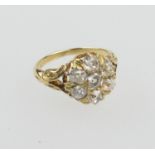 Diamond cluster ring, in 18ct yellow gold, set with seven old round cut diamonds, total diamond
