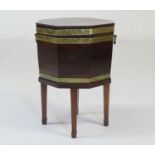 George III mahogany cellarette, circa 1780, octagonal form, brass bound and with brass carrying