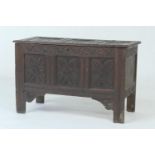 Oak joined coffer, late 17th Century, later carved decoration, having a lozenge recessed panel top