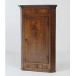 Mahogany and inlaid flat front hanging corner cupboard, early 19th Century, having a keyed inlaid