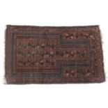 Balouch prayer rug, with madder ground, size approx. 130cm x 79cm (NB: Condition is NOT noted in