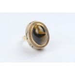 Unusual hand made South African tiger's eye dress ring, cabochon stone set within a deep mount