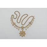 Edwardian seed pearl pendant fringe necklace, centred with an openwork flowerhead pendant/brooch, in
