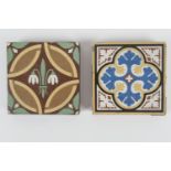 Two William Godwin encaustic terracotta tiles, both of formal design, one centred with stylised Lily