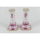 Pair of Meissen porcelain dwarf candlesticks with puce floral decoration, height 10.5cm (NB: