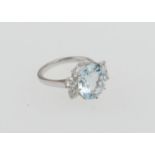 Aquamarine and diamond five stone ring, circa 1978, the oval cut aquamarine 12mm x 10mm x 6mm