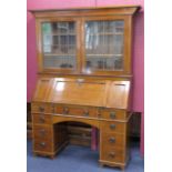 Arts and Crafts period mahogany kneehole bureau bookcase