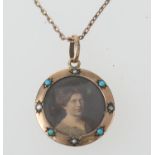 9ct gold turquoise and pearl circular picture locket, 23mm diameter, suspended from a 9ct gold chain