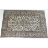 Kashan carpet, fawn field centred with a green and blue central medallion with similar spandrels,