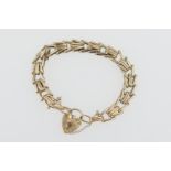 9ct gold chevron link bracelet, with padlock clasp and safety chain, weight approx. 16.3g (NB: