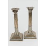 Pair of late Victorian silver Corinthian column candlesticks, by Hawksworth Eyre, Sheffield 1899,