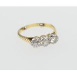 Diamond three stone ring, having three round cut diamonds totalling approx. 0.85ct. mounted in