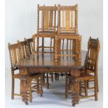 Victorian carved oak extending dining table, and a set of twelve oak barleytwist dining chairs,