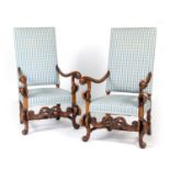 Pair of William and Mary style walnut and upholstered armchairs of grand stature, blue gingham