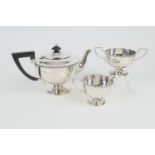 George V silver three piece tea service by Walker & Hall, Sheffield 1932/33, comprising footed U-