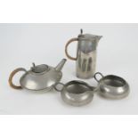 English pewter four piece tea service, for Liberty & Co., hammered form comprising teapot, hot water
