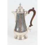 Elizabeth II silver hot water jug, London 1974, plain baluster form with hinged domed cover,