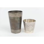 Indo-Persian white metal beaker, circa 1900, tapered form decorated with bands of scrolling foliage,