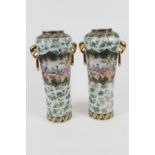 Pair of Chinese Republic porcelain vases, with gilded elephant mask and ring handles, decorated with