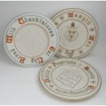 Three Victorian Gothic Revival Parian plates, each moulded with a motto, decorated with gilt and