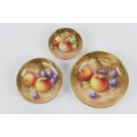 Three Royal Worcester fruit decorated pin dishes, the largest decorated with apples and cherries,