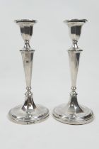 Pair of Edwardian silver candlesticks, Sheffield 1904, tapered octagonal form over a circular loaded
