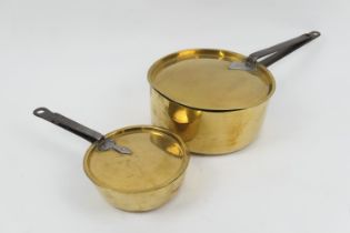 19th Century brass lidded saucepan with steel handle, 26cm diameter; also a smaller lidded pan, 19cm