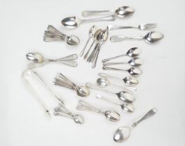 Assorted silver flatware, mostly spoons but including a pair of Victorian silver rose and