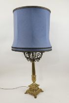 Decorative gilt brass table lamp, late 20th Century, with four candle branches centred with an