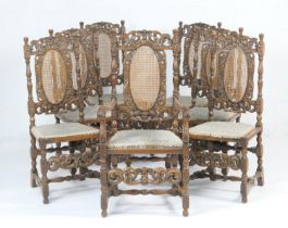 Set of seven carved oak dining chairs in the Carolean style, comprising six singles and one