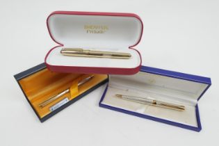 Shaeffer Prelude gold plated fountain pen, with box, papers and two cartridges; also Waterman,