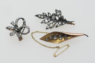 Victorian diamond set leaf brooch, set with 19 old cushion and rose cut stones, the largest being